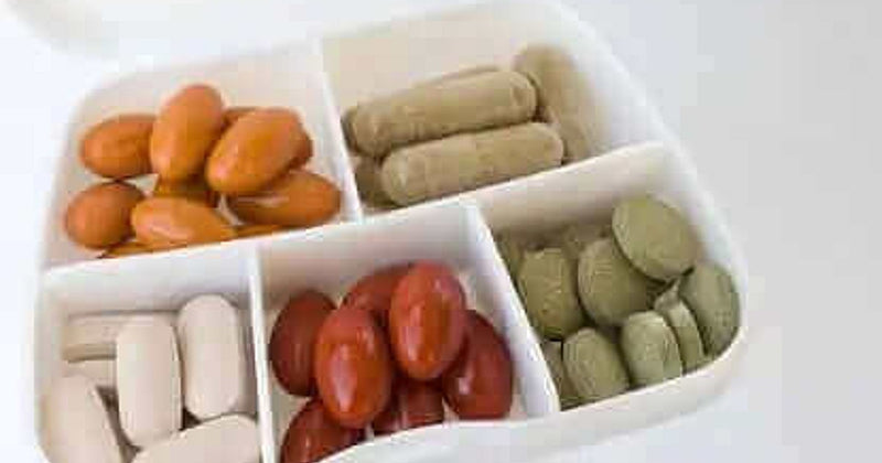 Life extension supplements including NMN, resveratrol and curcumin arranged for a longevity research article